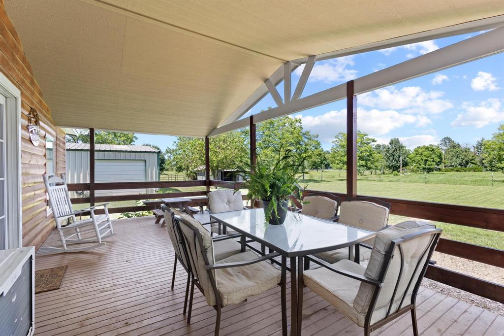 489 Delphia Drive Denison, TX 75021 - Photo 8 of 40 a view of a patio with a table chairs and a table