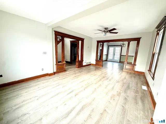 a kitchen with stainless steel appliances granite countertop a refrigerator a sink and a stove