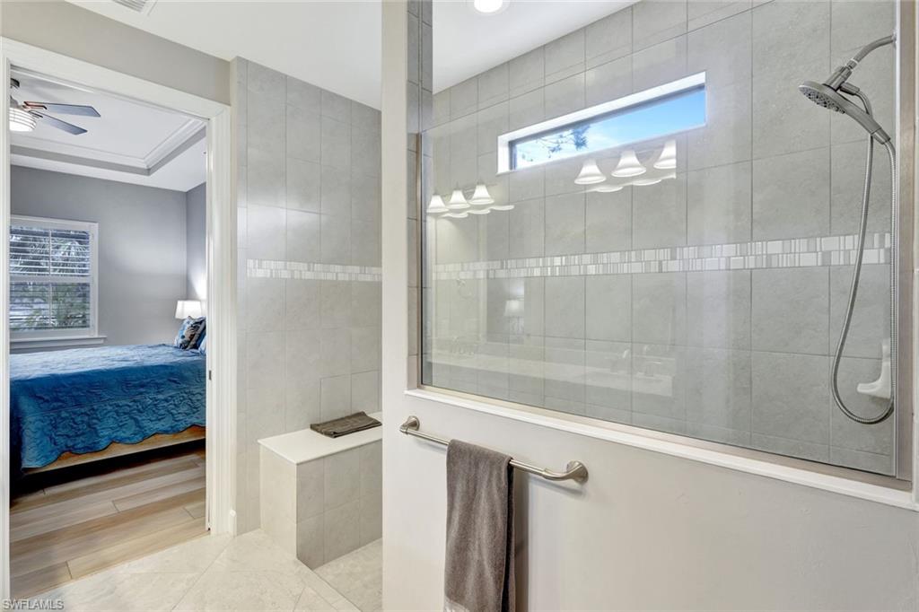 7451 Blackberry Drive Naples, FL 34114 - Photo 18 of 30 a bathroom with a shower
