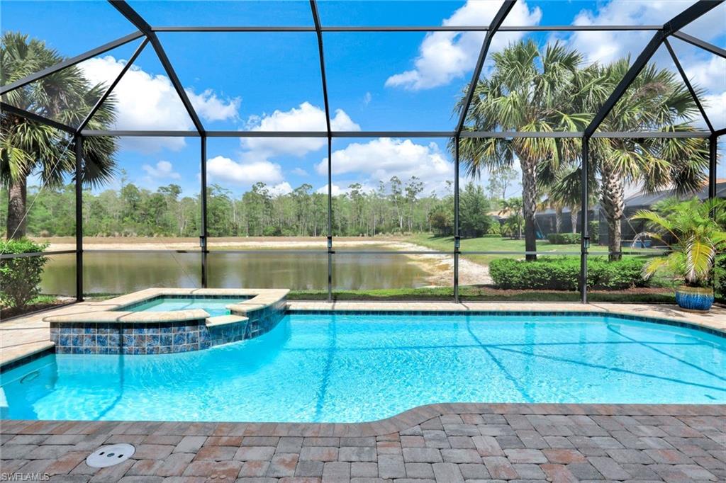 7451 Blackberry Drive Naples, FL 34114 - Photo 2 of 30 a view of outdoor space with swimming pool and furniture
