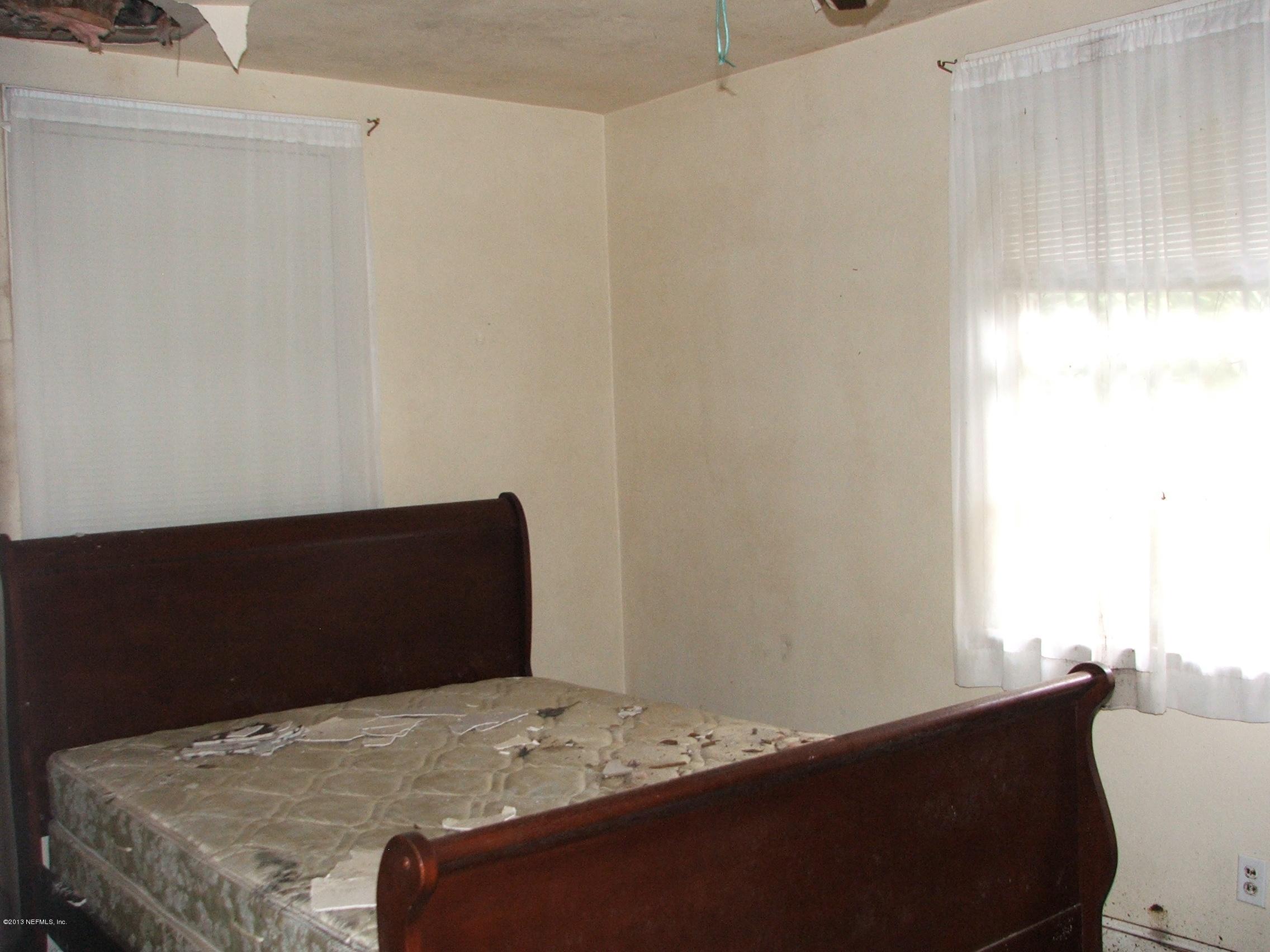 1451 Parental Home Road Jacksonville, FL 32216 - Photo 21 of 25 Bedroom with damage to ceiling