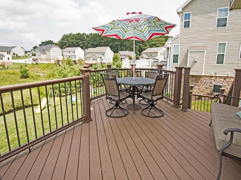 2023 Eagle Ridge Drive Valencia, PA 16059 - Photo 12 of 15 Composite deck built in 2014 is perfect for entertaining. Steps lead you down to the flat backyard space.