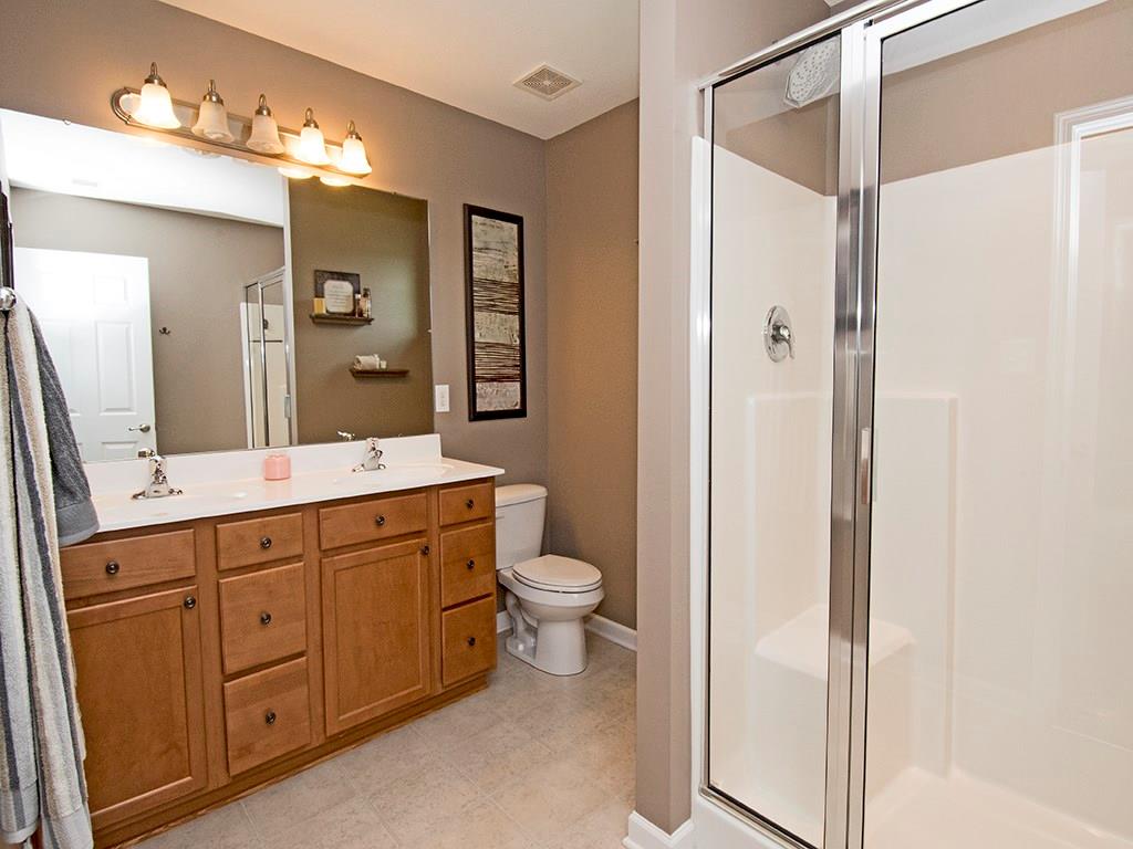 2023 Eagle Ridge Drive Valencia, PA 16059 - Photo 8 of 15 Upgraded master bath offers double bowl vanity w/ maple cabinets.