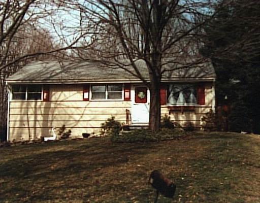 57 Glen Ridge Road Fairfield, CT 06825 - Photo 1 of 1 a front view of a house with a yard