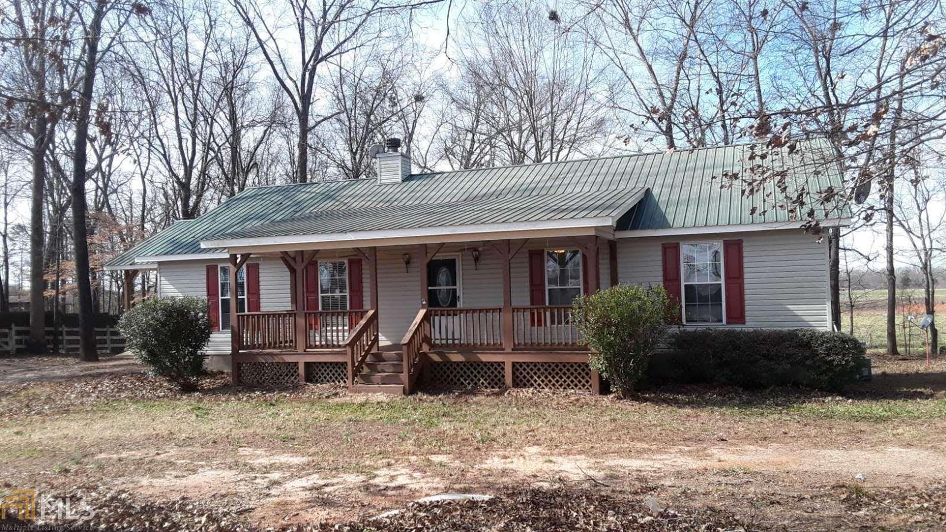 1628 Neese Commerce Road Commerce, GA 30530 - Photo 1 of 1 a front view of a house with garden