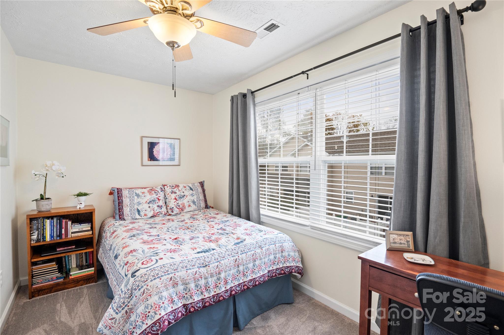 204 Pembrook Road Swannanoa, NC 28778 - Photo 12 of 15 a bedroom with a bed and a chandelier