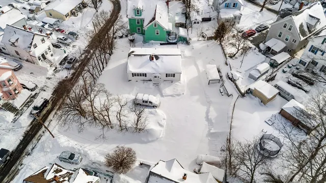 an aerial view of a residential houses with outdoor space
