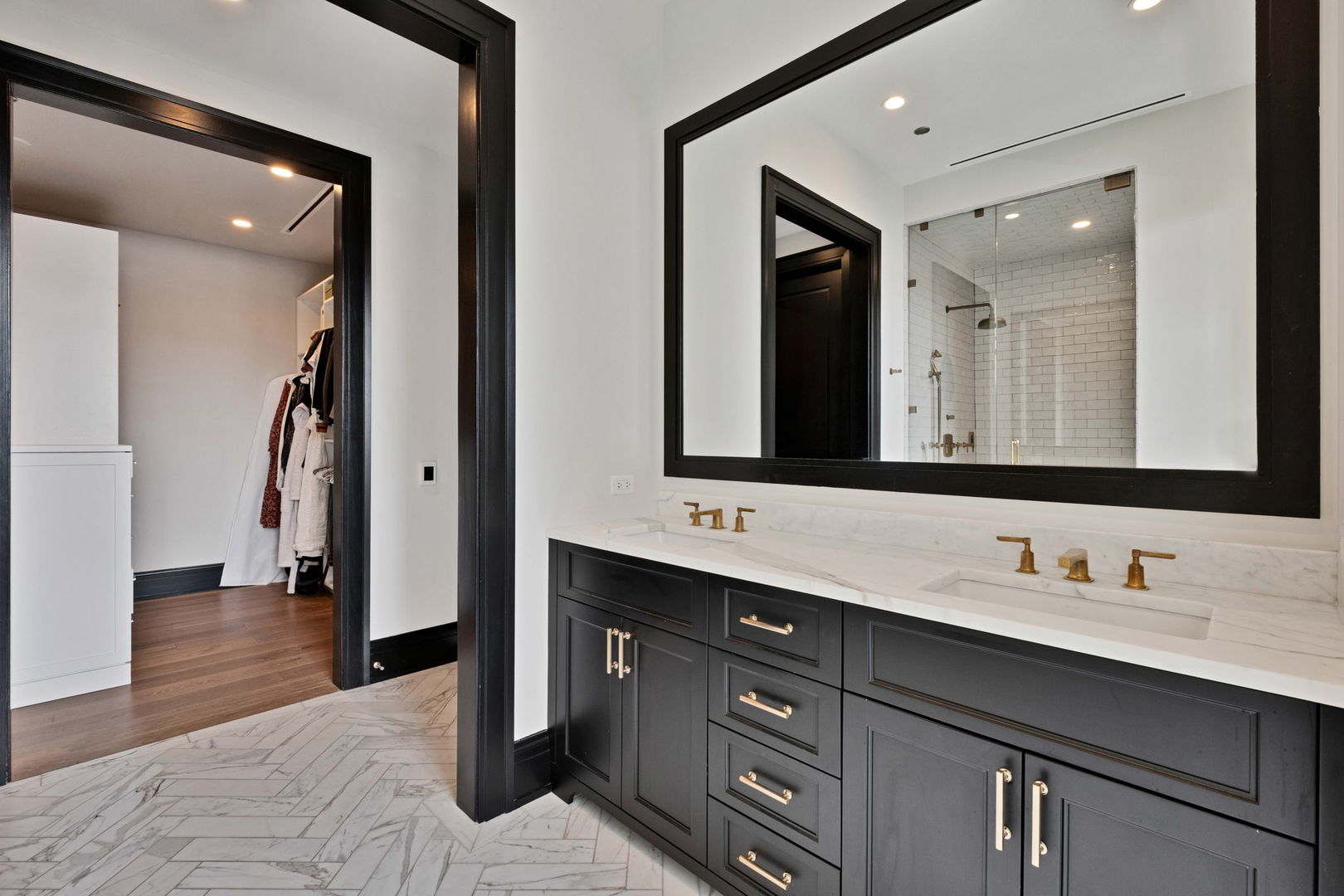 1109 West Washington Boulevard, Unit 5C Chicago, IL 60607 - Photo 26 of 31 a bathroom with a double vanity sink and a mirror