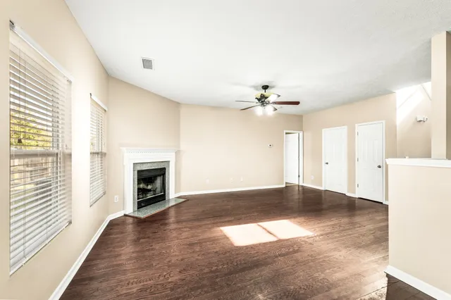 a view of a kitchen with a sink wooden floor and a kitchen