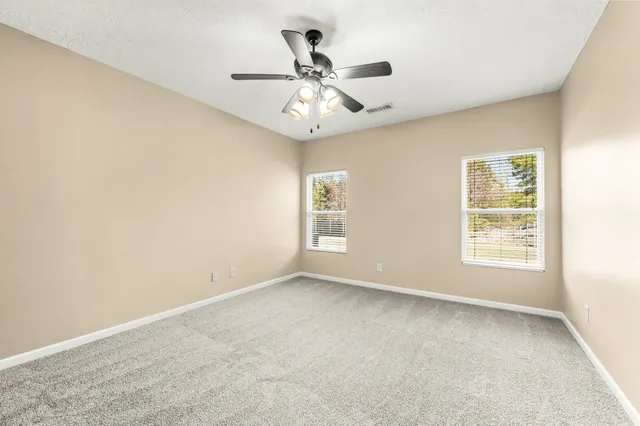 a bathroom with a sink double vanity and a mirror