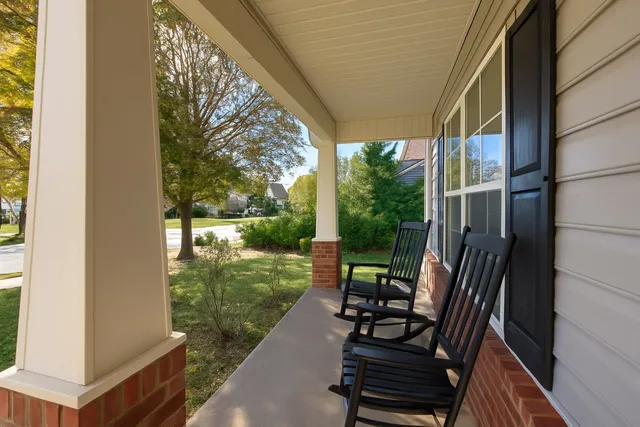 a view of two chairs in the balcony