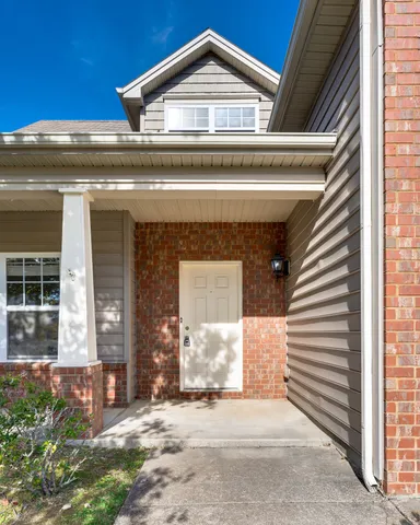 a view of a hallway with staircase