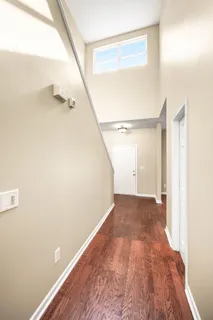 an empty room with windows and closet