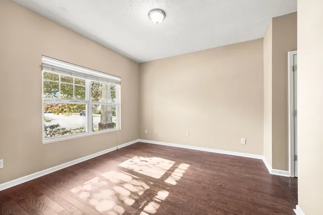 a view of a hallway view with wooden floor and staircase