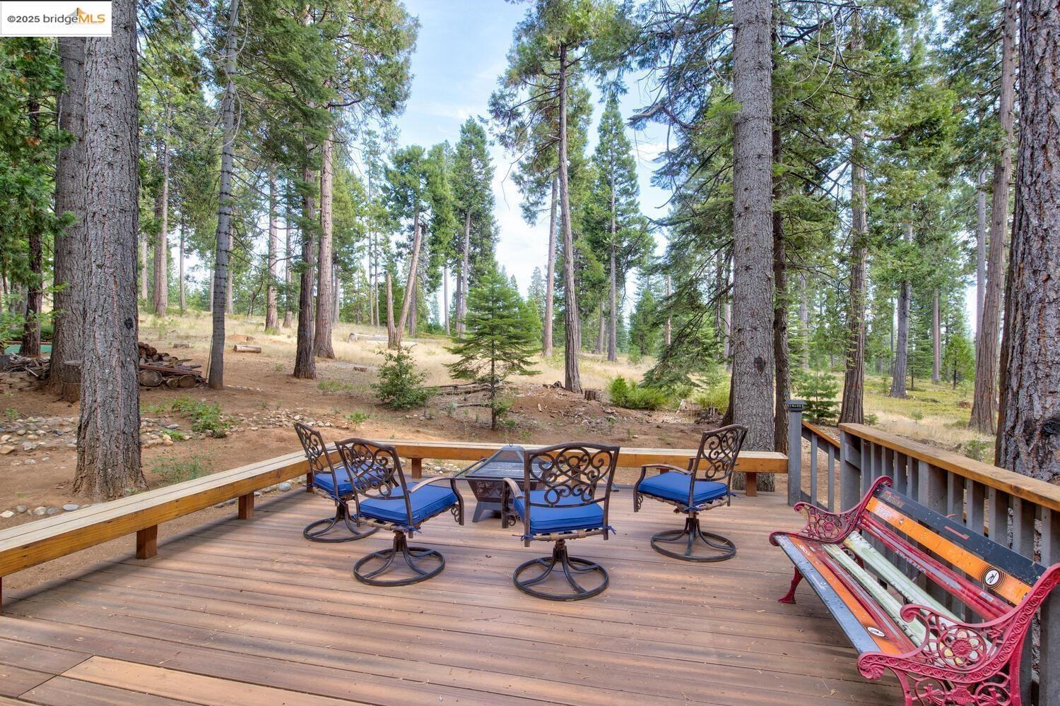 a view of outdoor sitting area with furniture and wooden floor