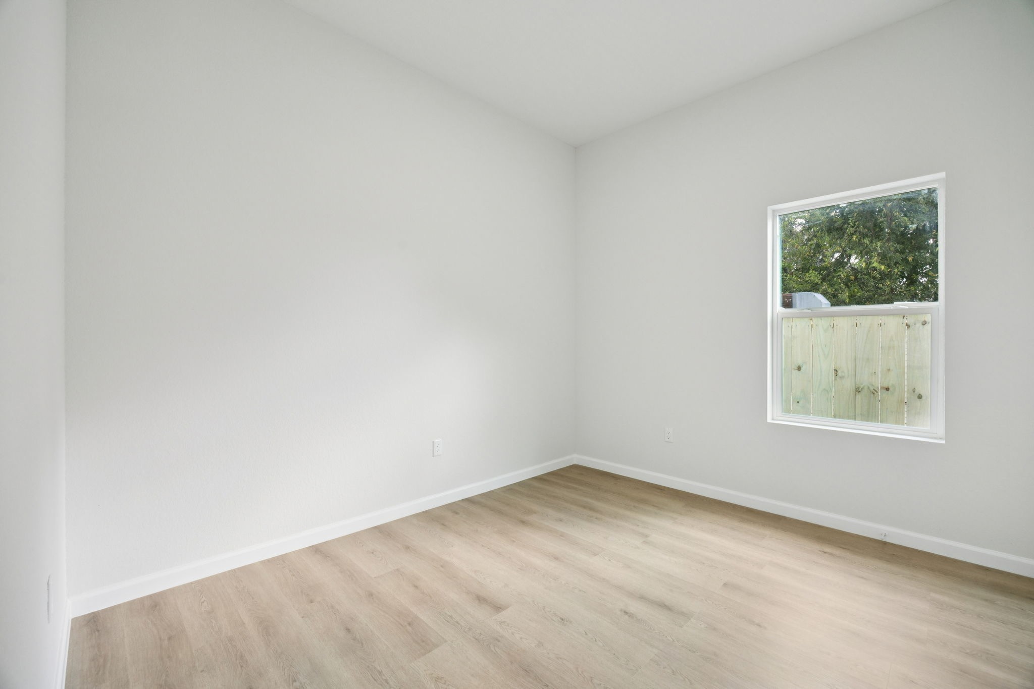 301 Cartersville Street, Unit B Houston, TX 77029 - Photo 12 of 23 an empty room with a window