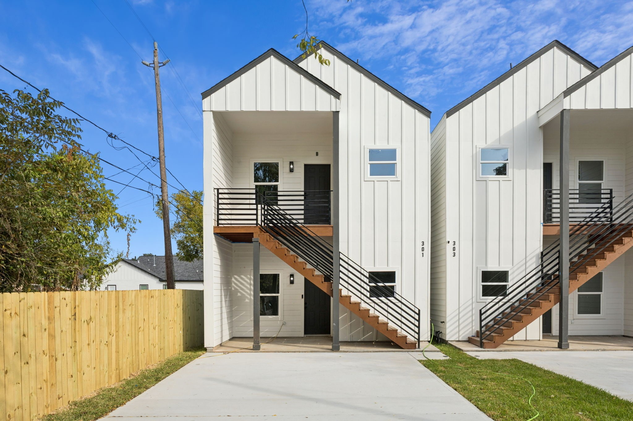 301 Cartersville Street, Unit B Houston, TX 77029 - Photo 2 of 23 a front view of a house with a yard