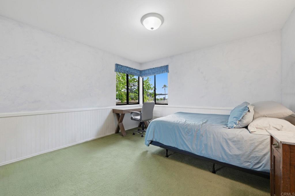1042 Hymettus Avenue Encinitas, CA 92024 - Photo 22 of 51 a bedroom with a bed and a window