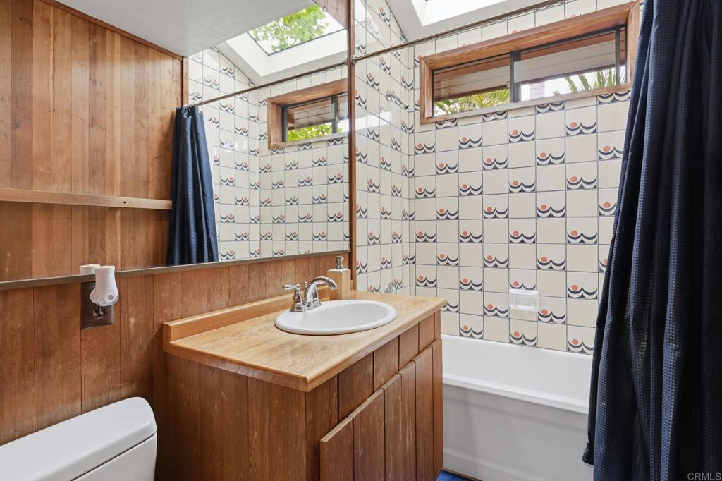 1042 Hymettus Avenue Encinitas, CA 92024 - Photo 23 of 51 a bathroom with a sink a toilet and shower