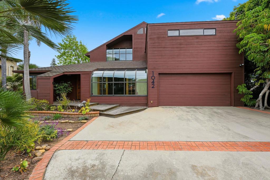 1042 Hymettus Avenue Encinitas, CA 92024 - Photo 7 of 51 a front view of a house with a yard
