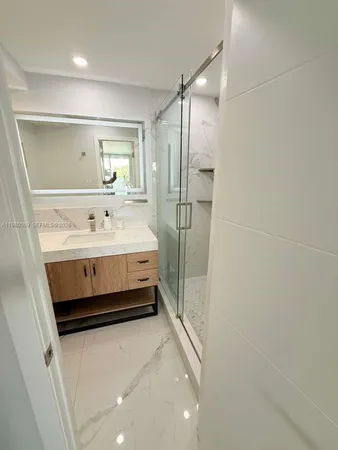 a bedroom with a bed and a table