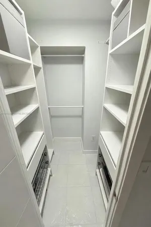 a view of an empty walk in closet