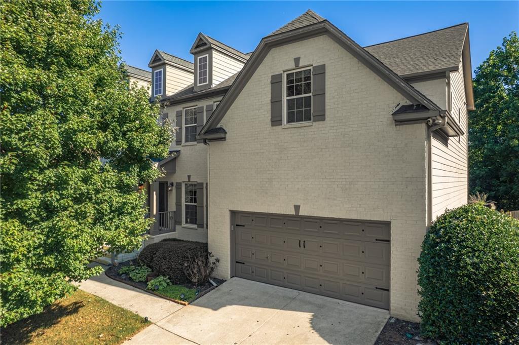 a front view of a house with trees