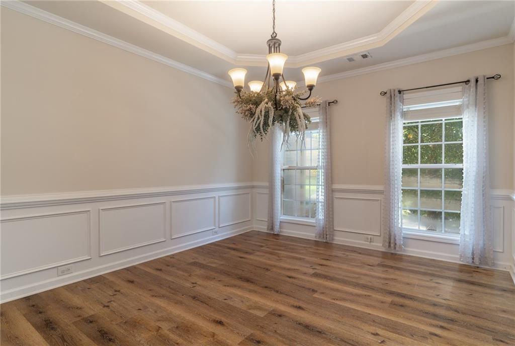 206 Sawtooth Court Canton, GA 30114 - Photo 12 of 43 a view of a room with wooden floor and a window