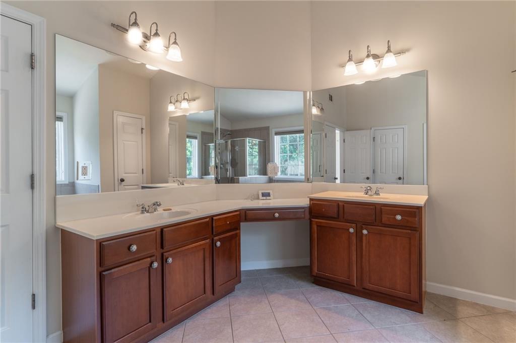 206 Sawtooth Court Canton, GA 30114 - Photo 20 of 43 a bathroom with a sink vanity and a mirror