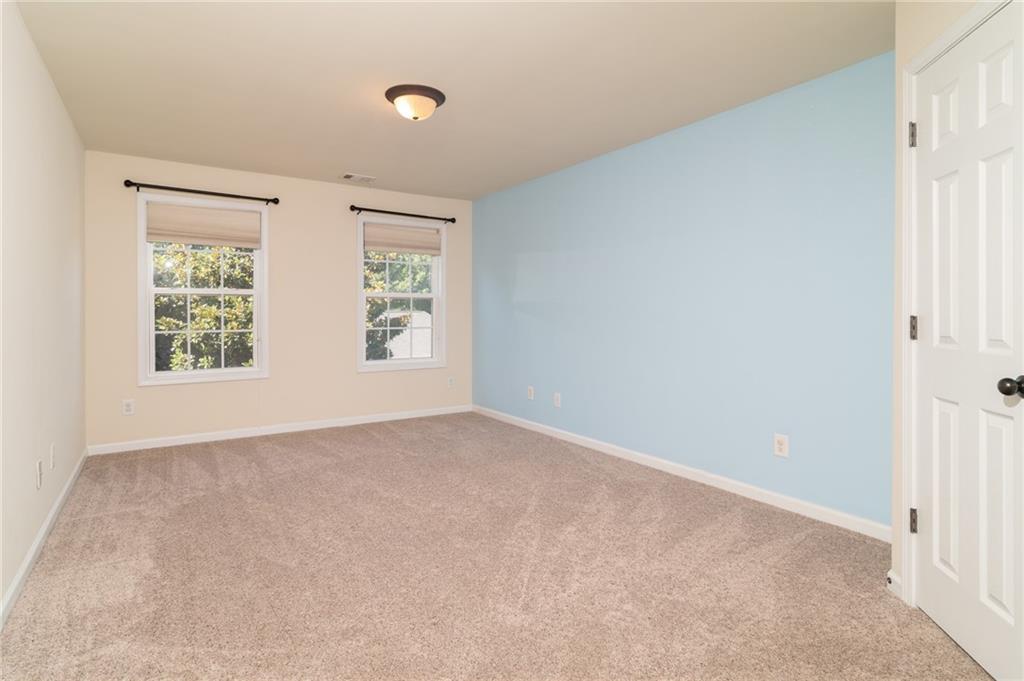 206 Sawtooth Court Canton, GA 30114 - Photo 22 of 43 an empty room with windows