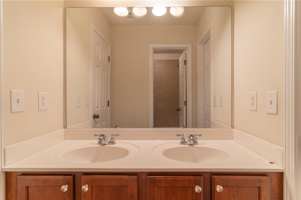 206 Sawtooth Court Canton, GA 30114 - Photo 25 of 43 a bathroom with double sink and a mirror