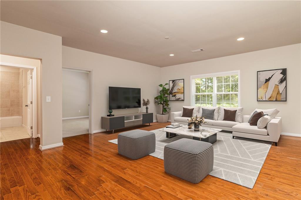 206 Sawtooth Court Canton, GA 30114 - Photo 5 of 43 a living room with furniture wooden floor and a flat screen tv