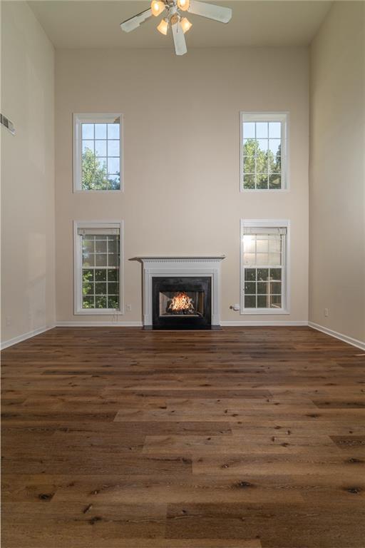206 Sawtooth Court Canton, GA 30114 - Photo 8 of 43 a view of an empty room with wooden floor and a window
