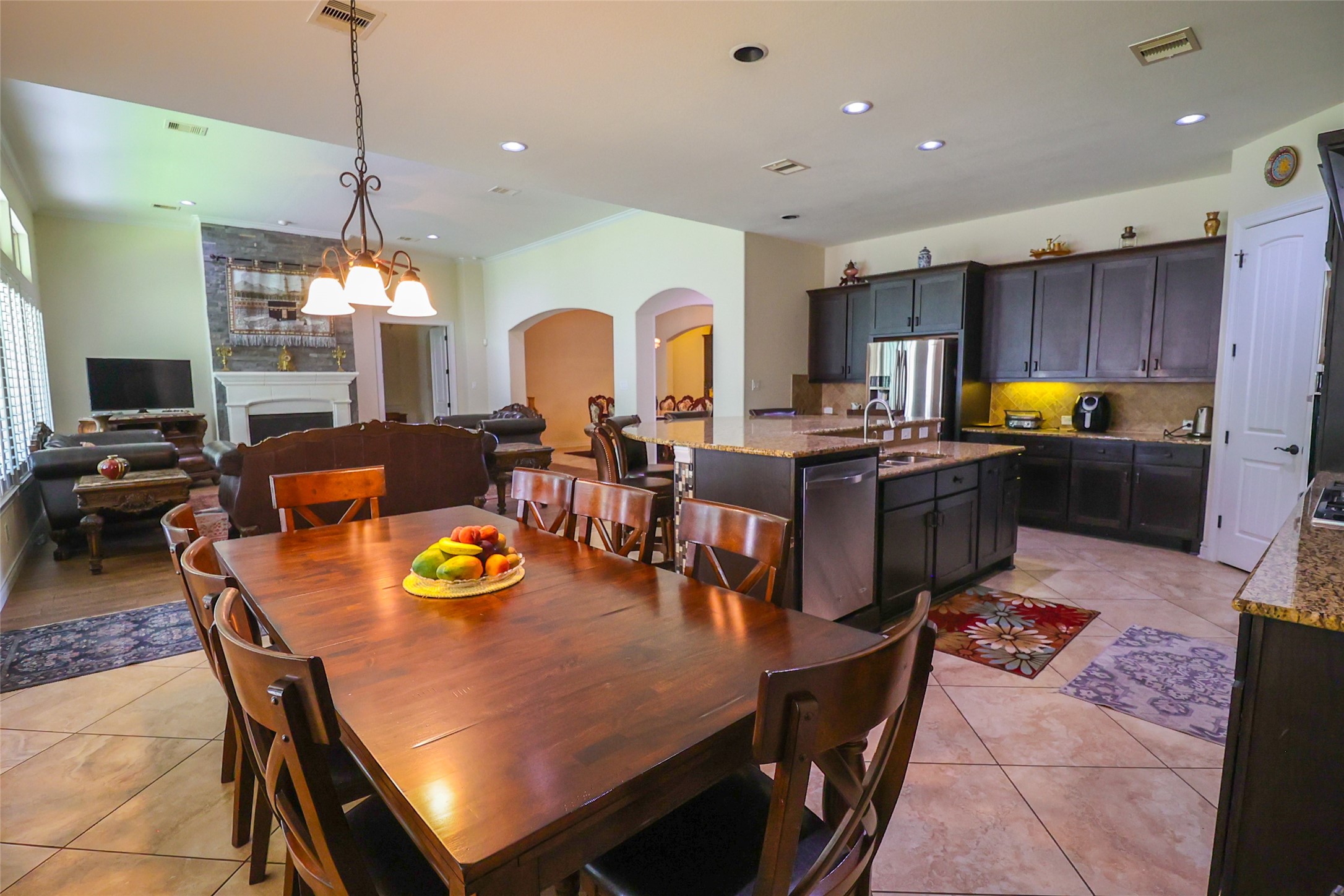 2406 Barclay Lake Lane Spring, TX 77388 - Photo 15 of 50 a living room with stainless steel appliances furniture a rug and a kitchen view