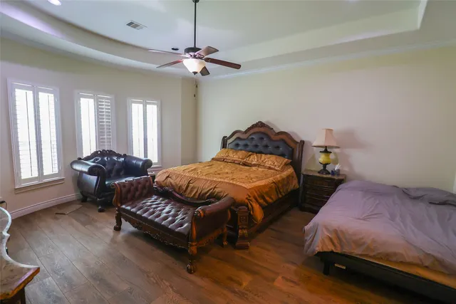 a bedroom with bed and window
