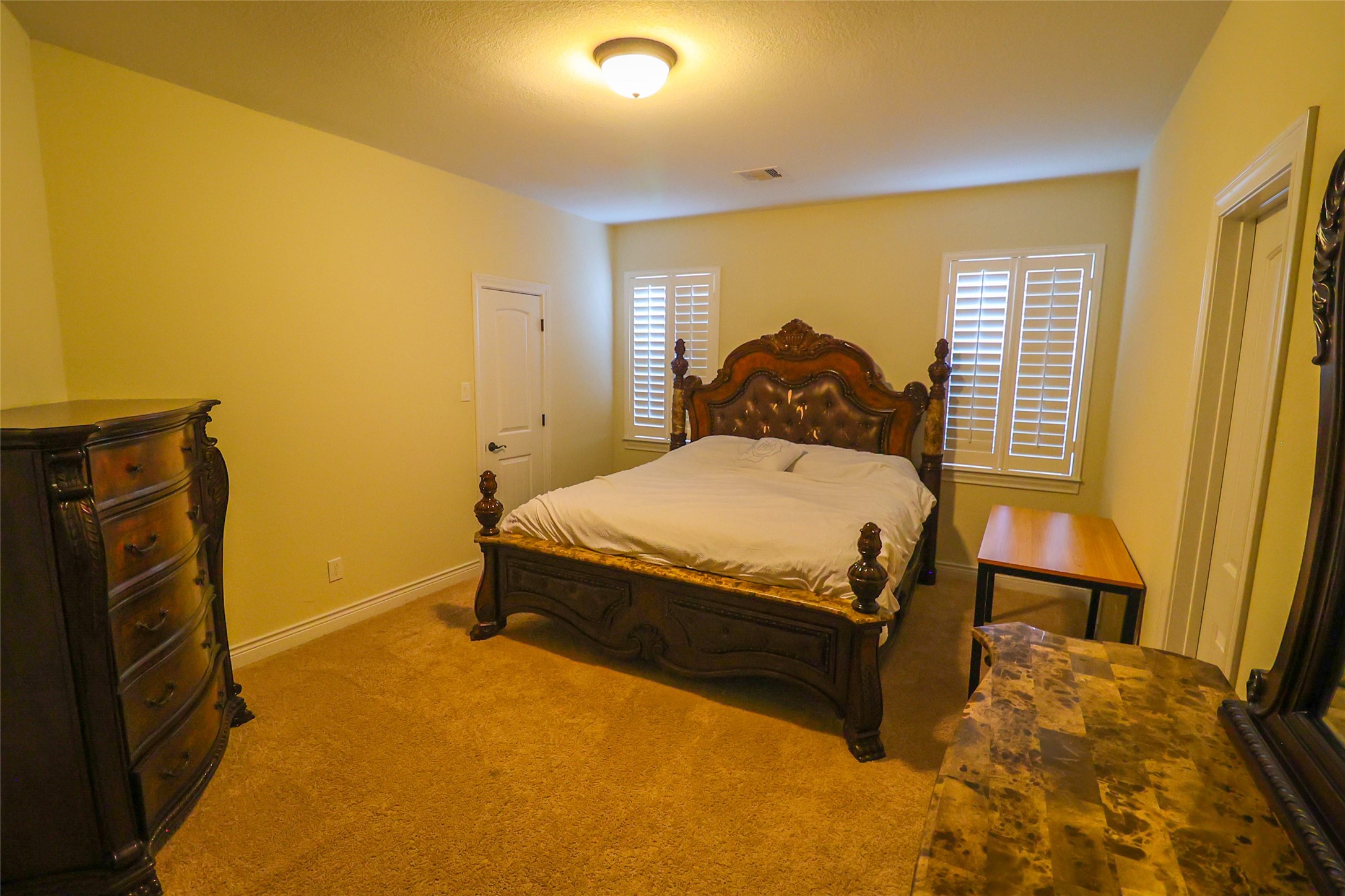 2406 Barclay Lake Lane Spring, TX 77388 - Photo 25 of 50 a bedroom with a bed and wooden floor