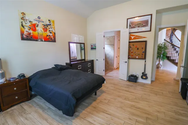a bathroom with a shower and a sink