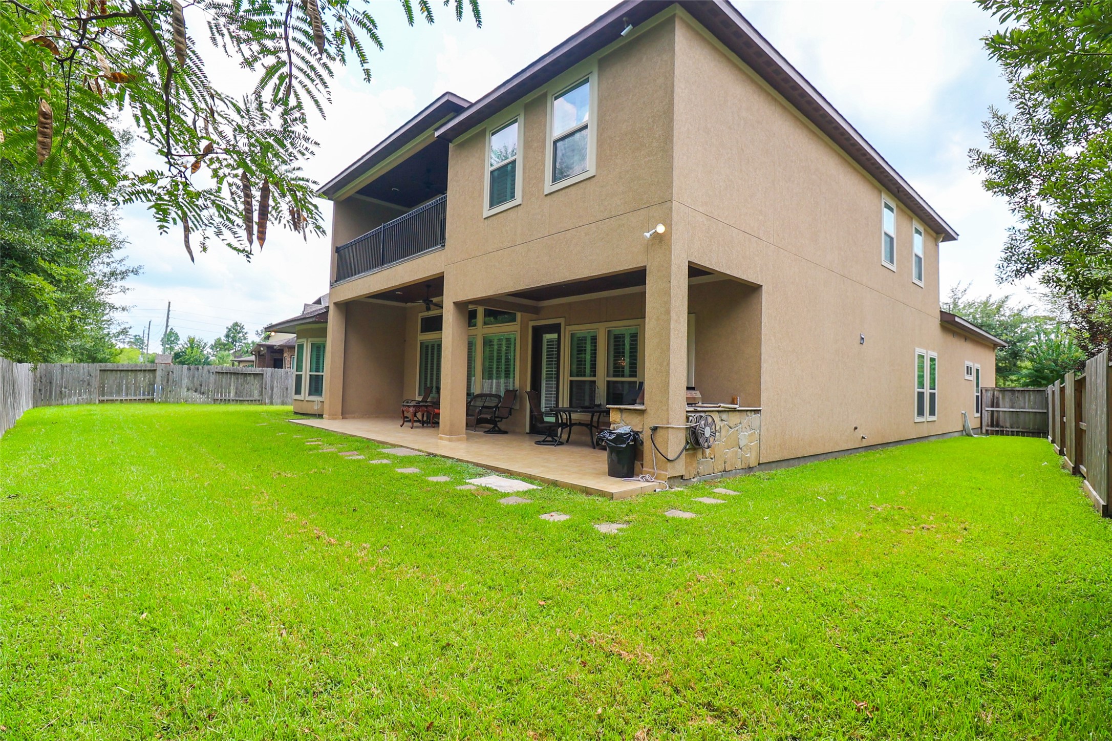 2406 Barclay Lake Lane Spring, TX 77388 - Photo 38 of 50 a view of a house with backyard porch and garden