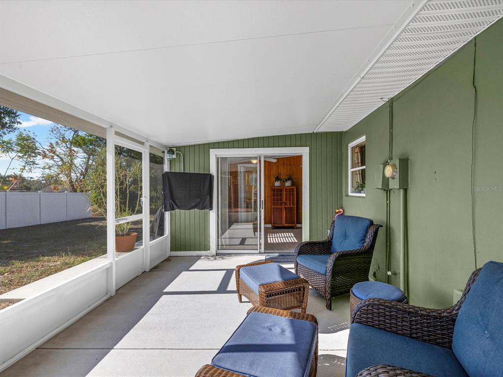 444 Edgehill Avenue Spring Hill, FL 34606 - Photo 27 of 32 a building outdoor space with patio furniture