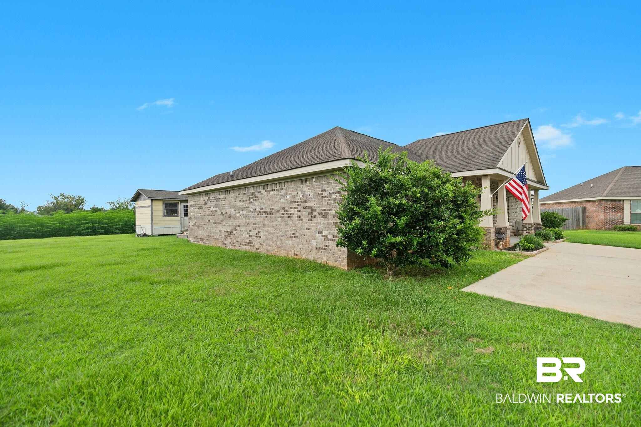 15573 Talus Court Foley, AL 36535 - Photo 34 of 50 View of side of property with a lawn