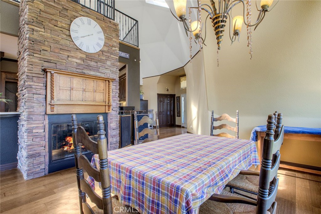 4434 Brodea Lane Fallbrook, CA 92028 - Photo 11 of 38 a bedroom with a bed and a chandelier