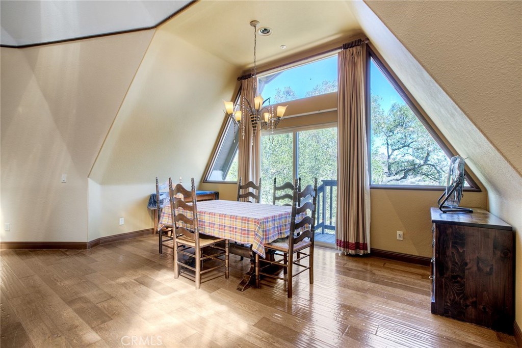 4434 Brodea Lane Fallbrook, CA 92028 - Photo 12 of 38 a dining room with furniture and wooden floor
