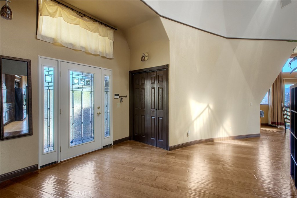 4434 Brodea Lane Fallbrook, CA 92028 - Photo 15 of 38 an empty room with wooden floor and windows