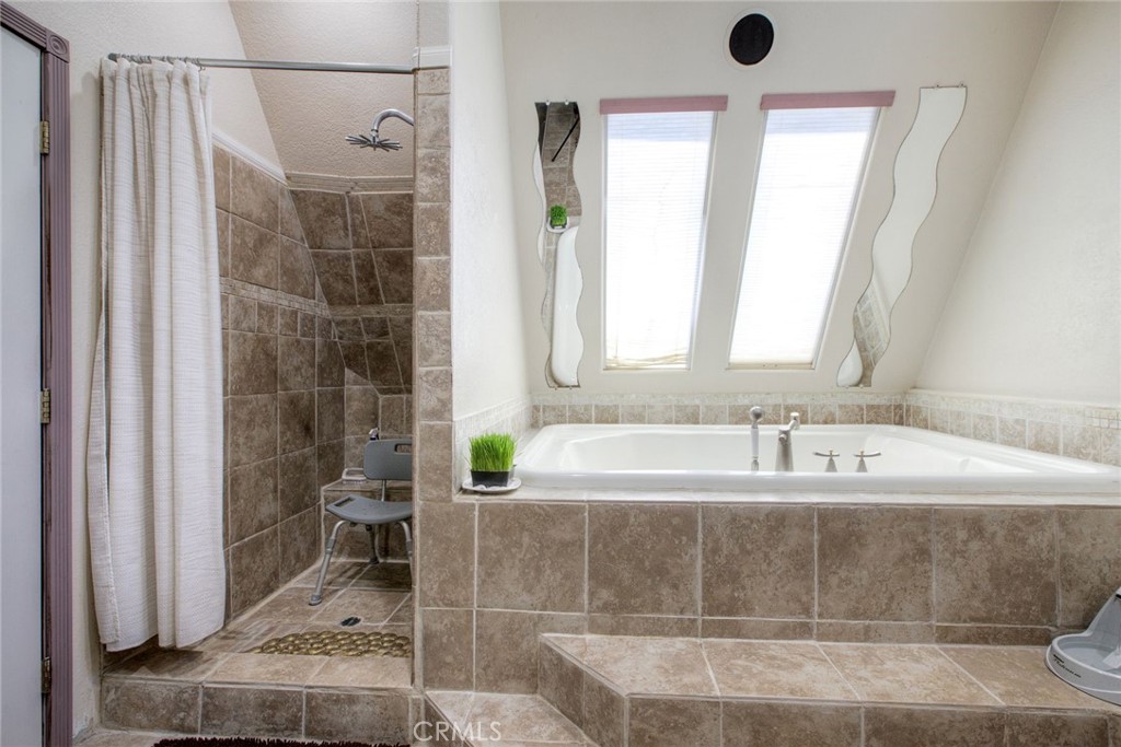 4434 Brodea Lane Fallbrook, CA 92028 - Photo 26 of 38 a bathroom with a bathtub and shower