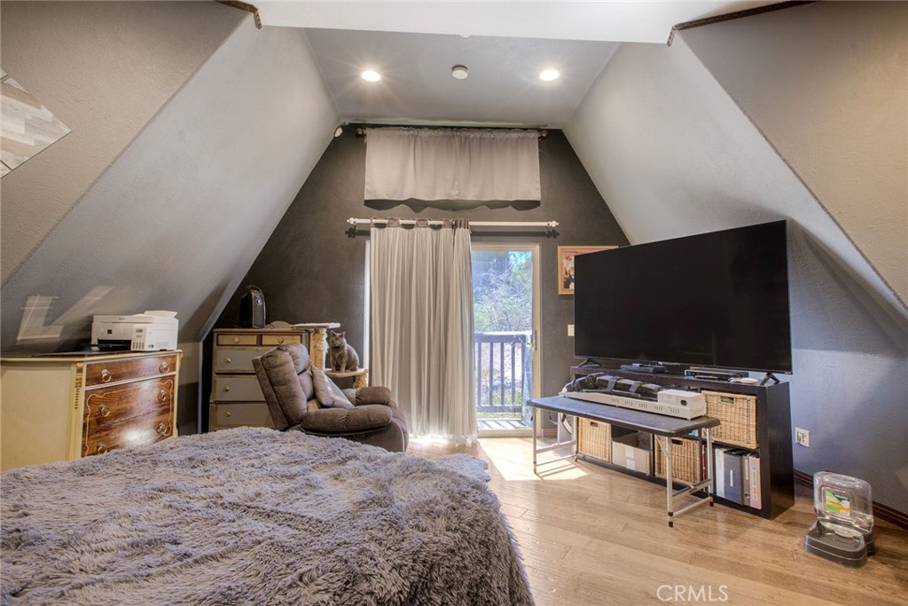 4434 Brodea Lane Fallbrook, CA 92028 - Photo 29 of 38 a bedroom with furniture and a flat screen tv