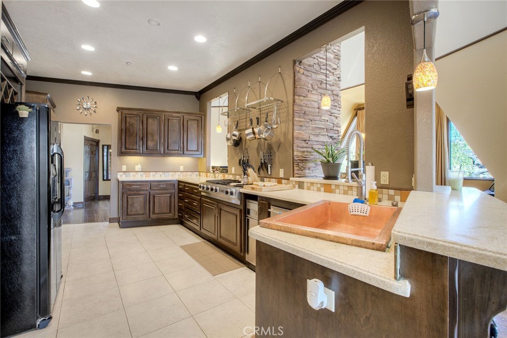 4434 Brodea Lane Fallbrook, CA 92028 - Photo 6 of 38 a kitchen with a sink stove and refrigerator