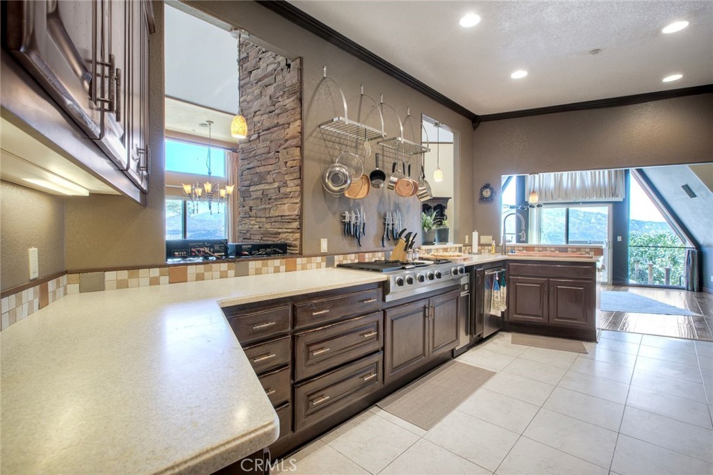 4434 Brodea Lane Fallbrook, CA 92028 - Photo 7 of 38 a large white kitchen with a large window