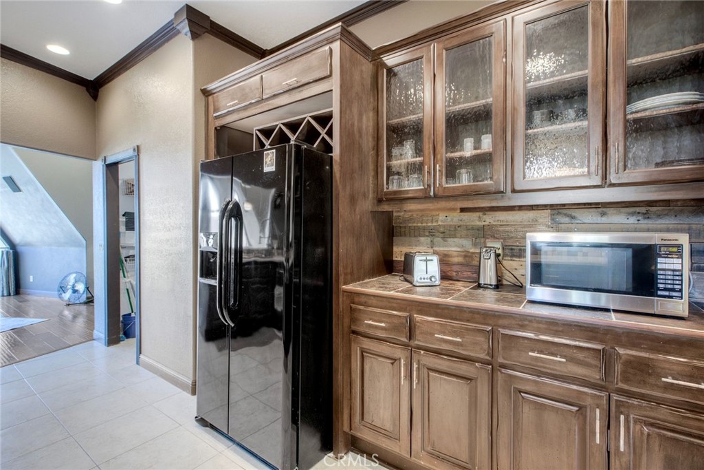 4434 Brodea Lane Fallbrook, CA 92028 - Photo 8 of 38 a kitchen with stainless steel appliances granite countertop a refrigerator and a sink