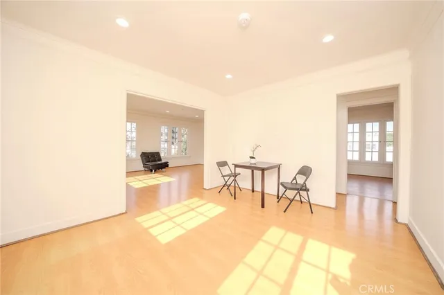 a view of kitchen with furniture and a refrigerator
