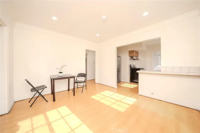 a living room with a bed and furniture